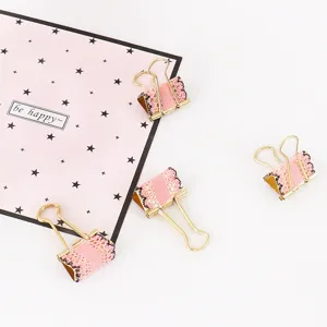 Pink lace metal binder clips detail view, aesthetic stationery for journaling and office use.