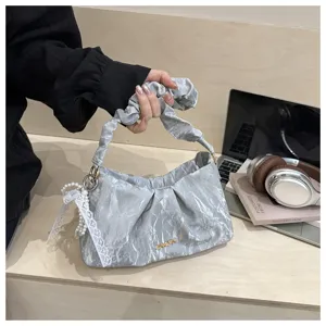 Silver crinkled underarm bag for women, trendy chic cloud shoulder bag with elegant pearl lace charm.