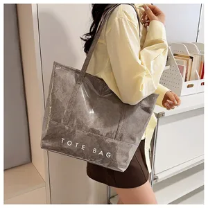 Große Pendler-Tote-Bag für Damen, wasserdichte PVC-Lackleder-Umhängetasche mit gedrucktem Logo.