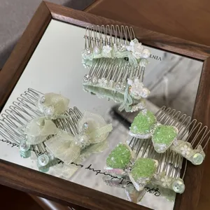Mint green hair comb set featuring elegant bows, sparkling rhinestones, and pearls for styling.