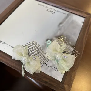 Mint green bow hair comb with pearls and rhinestones, perfect for sweet daily styling.
