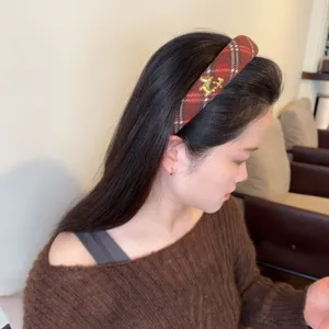 Red plaid headband with gold horse charm, chic woolen hair hoop for women and girls.