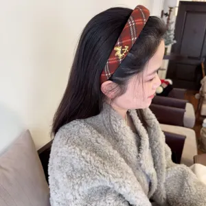 Red plaid headband with gold horse charm, sweet winter hair accessory for women and girls.