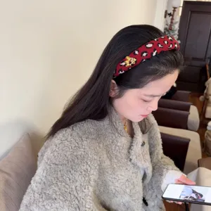 Red leopard woolen headband with cute horse charm, stylish winter hair hoop for women.