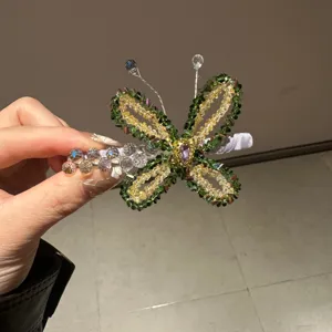Crystal beaded butterfly hair clip for women, exquisite side duckbill hair barrette detail.