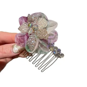 Crystal flower hair comb with purple organza petals and sparkling beaded side hair accessory.