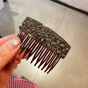 Sparkling rhinestone hair comb with brilliant crystal inlay, elegant hair styling accessory.
