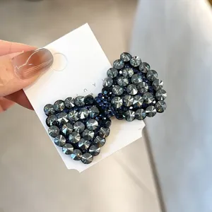 Pince à cheveux nœud strass scintillants cristal sombre barrette élégante accessoire.