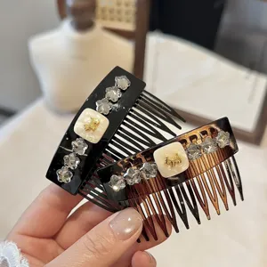 Rhinestone decorative hair comb detail shot, elegant crystal side comb for stylish hairstyles.