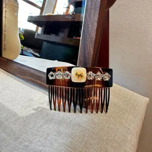 Korean chic tortoise shell hair comb with sparkling rhinestones and cute dog accent for stylish women.