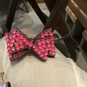 Pince à cheveux nœud strass rose haut de gamme, barrette cristal brillante pour coiffure élégante.