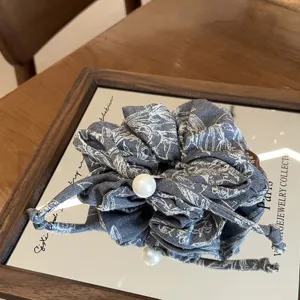 Exquisite grey denim fabric hair scrunchie with elegant pearl charm, vintage floral design.