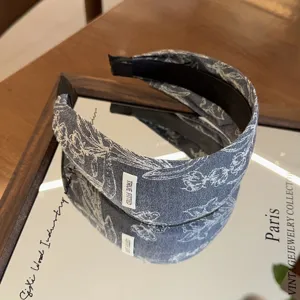 Denim embroidered hairband detail view, stylish casual floral denim headband accessory.