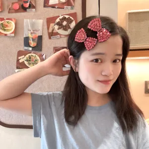 Pince à cheveux double nœud en strass rose scintillant pour femmes, joli clip frange.