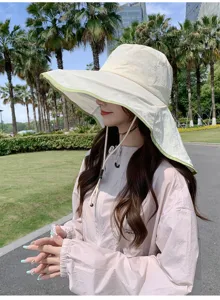 Detail shot of the wide-brim sun protection hat with neck flap for outdoor summer activities.
