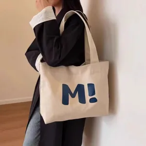 Large capacity canvas tote bag for women, versatile shoulder handbag for daily use.