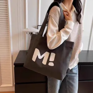 Canvas tote bag for women, large capacity casual shoulder bag with white letter print.