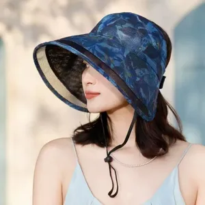 Blue floral wide brim sun hat featuring an empty top, breathable mesh, and secure chin strap.