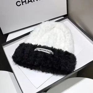 Winter cute plush knitted beanie hat in black and white contrast warm slouchy cap