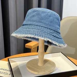 Washed denim bucket hat for women, spring summer distressed raw edge sun protection cap.