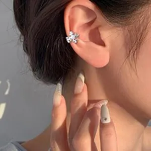 Dazzling crystal flower ear cuff for women, chic non-pierced sparkly cartilage clip-on earring.