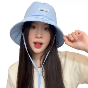 Stylish light blue bucket hat for women, summer sun protection casual outdoor cap.