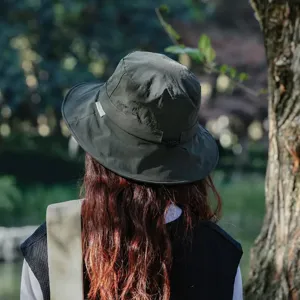 Women outdoor sun protection quick drying bucket hat with windproof cord for hiking summer.