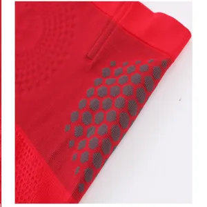 Red seamless high-waist tummy control shapewear detail with honeycomb anti-slip grip dots.