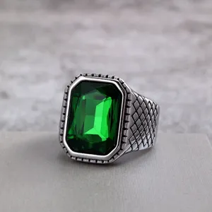 Vintage stainless steel men ring featuring a large green faceted stone and chic grid shank design.