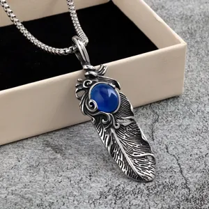 Vintage stainless steel men feather pendant with blue gemstone accessory detail view