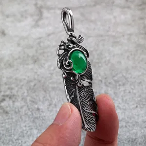 Stainless steel vintage feather green stone pendant detail with exquisite carving work.