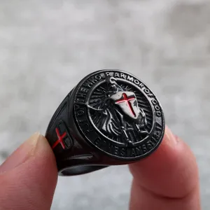 Close-up detail of vintage stainless steel men ring featuring medieval crusader cross and verse.