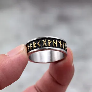 Detail view of Nordic vintage stainless steel men ring featuring engraved Viking runes.