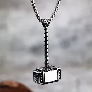 Vintage stainless steel Viking Thor's hammer pendant necklace for men, detailed textured metal.