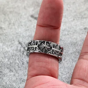 Close-up detail of vintage stainless steel men ring featuring distressed sun anchor design.