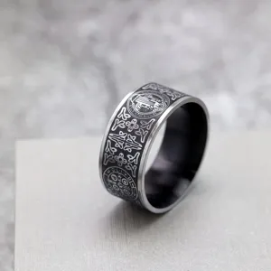 Vintage stainless steel men ring featuring Saint Benedict cross engraving and gothic style.