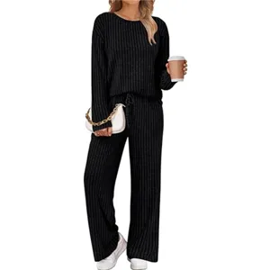 Black ribbed knit two-piece lounge set detail, comfortable long sleeve top and wide leg pants.