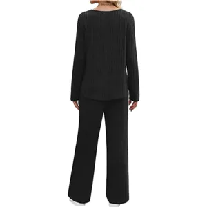 Black ribbed long-sleeve top and wide-leg trousers two-piece loungewear set rear view.