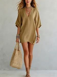 Casual V-neck solid color resort top detail, showing relaxed fit and elegant styling.