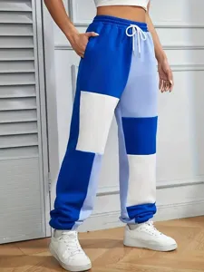 Close-up detail of women color-blocked casual sweatpants with drawstring mid waist.