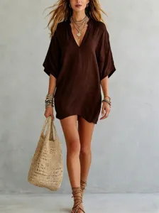 Detail view of a casual solid brown V-neck loose t-shirt, elegant resort style top.
