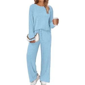 Detailed view of the light blue ribbed lounge set featuring a casual round neck top and wide leg pants.
