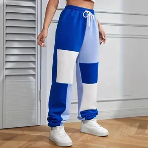 Stylish color block sweatpants for women featuring comfortable drawstring mid waist.