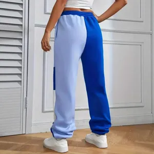 Women color block casual sweatpants back view, autumn mid waist drawstring trousers stylish.