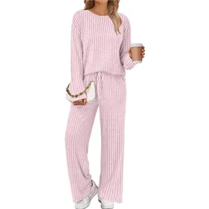 Detailed view of women pink ribbed knit loungewear set featuring long sleeve top and pants.