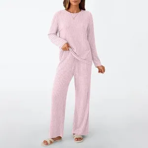 Women's pink ribbed long sleeve top and wide leg trousers loungewear set casual outfit.