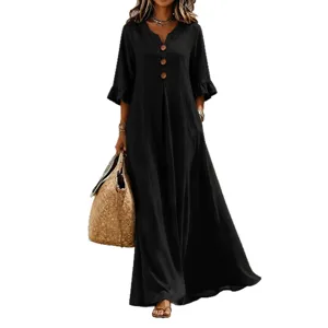 Elegant black maxi dress with V-neck, buttons, and ruffles. Comfortable loose fit style.
