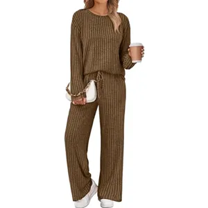 Casual knit two-piece loungewear set with ribbed crewneck top and comfortable wide-leg trousers.