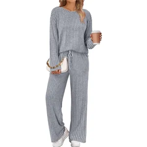 Ribbed knit long sleeve top and wide-leg pants detail shot showing texture and fit.