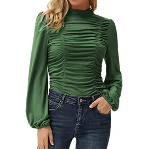Dark green long sleeve mock neck ruched slim top detail view showing stylish texture and fit.